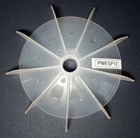 A plastic fan with the number pwe 0 7 on it.