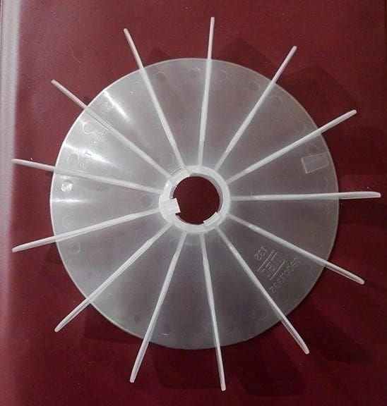 A plastic disc with toothpicks stuck in it.