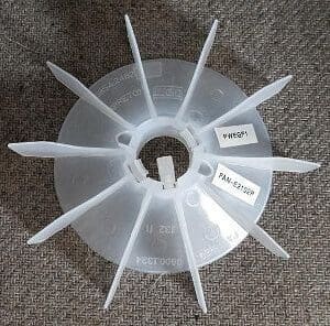 A plastic fan with labels on it.