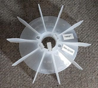 A plastic fan with labels on it.