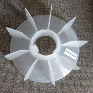 A plastic fan is sitting on the floor.